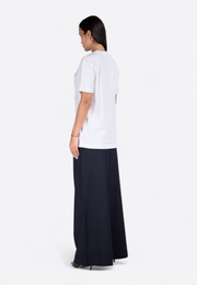 Back view of relaxed waist black trousers on model, East Vibe